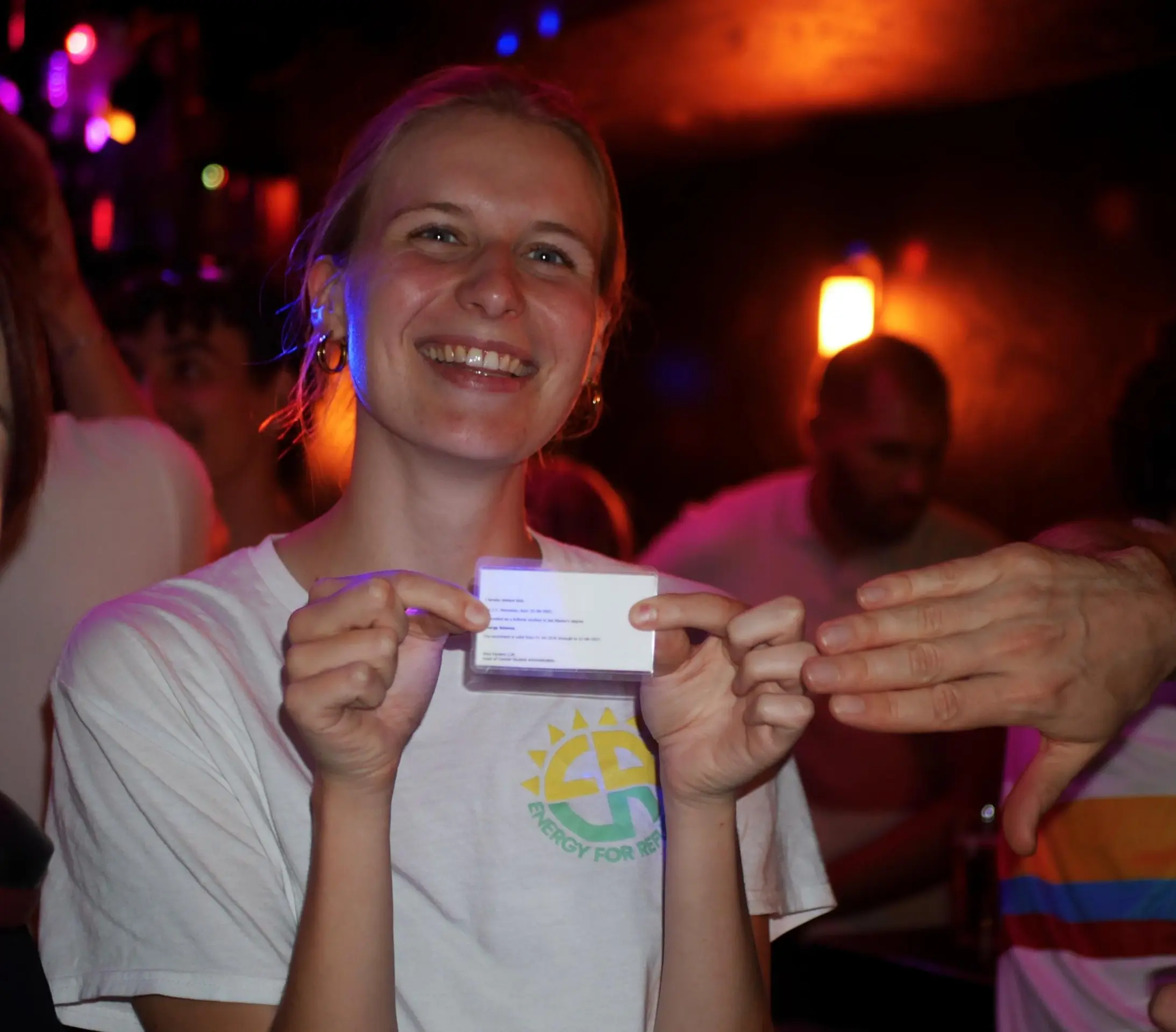 A woman holding her convenience card